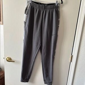 Nike Gray Sweatpants with Elastic Waistband and Tapered Legs